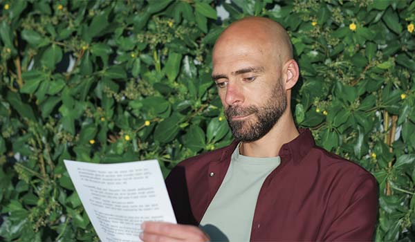 Álvaro Torres reviewing a translation with cultural adaptation notes