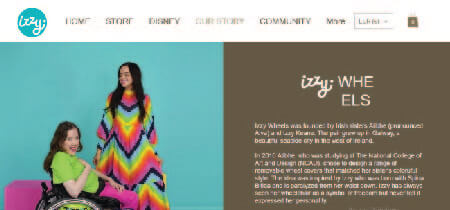 Photo of two women in colorful outfits in the About Us section of the Izzy Wheels page